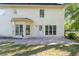 A concrete patio leading to a rear exterior and a lush lawn at 120 Julia Ct, Fayetteville, GA 30214
