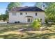 Spacious backyard with mature trees, a lush lawn, and a home featuring a patio at 120 Julia Ct, Fayetteville, GA 30214