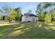 Large backyard with green grass and mature trees surrounding the property at 120 Julia Ct, Fayetteville, GA 30214