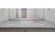 Bathroom with a double sink vanity featuring granite countertops and chrome fixtures at 120 Julia Ct, Fayetteville, GA 30214