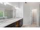 Bathroom featuring double sink vanity, and glass enclosed shower at 120 Julia Ct, Fayetteville, GA 30214