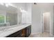 Modern bathroom featuring dual sinks, granite counters, and a glass shower at 120 Julia Ct, Fayetteville, GA 30214