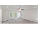 This bright bedroom features a trey ceiling, ceiling fan, and lots of natural light at 120 Julia Ct, Fayetteville, GA 30214