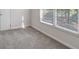 Cozy bedroom with natural light streaming through the windows and plush carpeting at 120 Julia Ct, Fayetteville, GA 30214