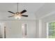 This spacious bedroom boasts a ceiling fan and large windows, providing ample light at 120 Julia Ct, Fayetteville, GA 30214