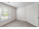 Bedroom with neutral paint and carpet and a window with blinds at 120 Julia Ct, Fayetteville, GA 30214