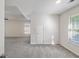 A well lit carpeted bedroom with a window view at 120 Julia Ct, Fayetteville, GA 30214