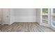 A dining room features wood-look flooring and a window at 120 Julia Ct, Fayetteville, GA 30214