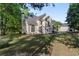 Charming two-story traditional home featuring manicured lawn and mature trees at 120 Julia Ct, Fayetteville, GA 30214