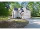Charming two-story traditional home featuring side-entry garage and mature trees at 120 Julia Ct, Fayetteville, GA 30214
