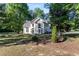 Charming two-story home with a well-manicured lawn and mature trees at 120 Julia Ct, Fayetteville, GA 30214