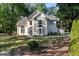 Charming two-story traditional home with a well-manicured lawn and lush landscaping at 120 Julia Ct, Fayetteville, GA 30214