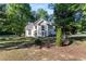 Charming two-story traditional home with a well-manicured lawn and lush landscaping at 120 Julia Ct, Fayetteville, GA 30214