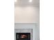 Close-up of a fireplace with white mantle and marble surround at 120 Julia Ct, Fayetteville, GA 30214