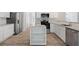 Bright kitchen featuring an island, stainless appliances, granite counters and eat-in breakfast area at 120 Julia Ct, Fayetteville, GA 30214