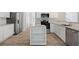 Charming kitchen with white cabinets, stainless steel appliances, and a functional center island at 120 Julia Ct, Fayetteville, GA 30214