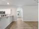 Open kitchen space with a breakfast bar and an arched doorway at 120 Julia Ct, Fayetteville, GA 30214