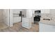 Modern kitchen featuring stainless steel appliances, white cabinets, and granite countertops at 120 Julia Ct, Fayetteville, GA 30214