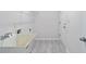 Laundry room featuring utility sink, tile floor and storage rack at 120 Julia Ct, Fayetteville, GA 30214
