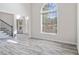 Bright living room with large windows, neutral walls, and elegant floors at 120 Julia Ct, Fayetteville, GA 30214