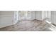Bright living room with wood flooring, bay window, and white trim at 120 Julia Ct, Fayetteville, GA 30214