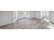 Bright living room with beautiful light gray floors and a bay window at 120 Julia Ct, Fayetteville, GA 30214