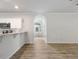Bright living room with view of the kitchen, recessed lighting and hardwood floors at 120 Julia Ct, Fayetteville, GA 30214