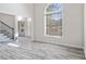 Bright living room with high ceilings, and light-colored wood floors at 120 Julia Ct, Fayetteville, GA 30214