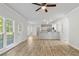 Open living area with view of the kitchen, recessed lighting, and wood floors at 120 Julia Ct, Fayetteville, GA 30214