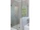 Modern bathroom featuring glass enclosed shower with sleek fixtures and tile surround at 120 Julia Ct, Fayetteville, GA 30214