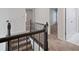 Hallway with carpet and wood banister leading to staircase at 120 Julia Ct, Fayetteville, GA 30214