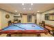 Basement game room with pool table and finished features for entertaining and relaxation at 2439 Huntington Park Nw Dr, Acworth, GA 30101