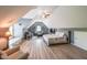 Versatile bedroom space featuring a bed, living space, hardwood floors, and a high ceiling at 2439 Huntington Park Nw Dr, Acworth, GA 30101