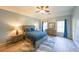 Relaxing bedroom with a ceiling fan, wood flooring, and a view of the front yard at 2439 Huntington Park Nw Dr, Acworth, GA 30101