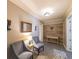 Inviting entryway with neutral paint, accent furniture, and wood accent wall creating a cozy first impression at 2439 Huntington Park Nw Dr, Acworth, GA 30101