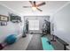 Well-equipped home gym with exercise equipment, mats, weights, and a ceiling fan to promote a healthy lifestyle at 2439 Huntington Park Nw Dr, Acworth, GA 30101