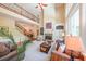 Bright living room with fireplace, large windows, and elegant decor, perfect for entertaining at 2439 Huntington Park Nw Dr, Acworth, GA 30101