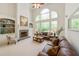 Spacious living room with fireplace, large windows, and elegant decor, perfect for entertaining at 2439 Huntington Park Nw Dr, Acworth, GA 30101