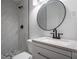 Modern bathroom featuring a tiled shower, updated fixtures, and stylish vanity at 5101 Rockbridge Rd, Stone Mountain, GA 30088