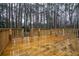 Spacious wooden deck with wooden railing overlooking the backyard area at 5101 Rockbridge Rd, Stone Mountain, GA 30088