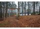 Scenic view of Chappell Valley Farms entrance with a wooden gate, lush greenery, and a glimpse of the house at 5101 Rockbridge Rd, Stone Mountain, GA 30088