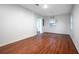 Inviting living room with wood-look flooring, neutral walls, and natural light at 5101 Rockbridge Rd, Stone Mountain, GA 30088