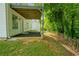 Backyard view of a walkout basement and lush landscaping at 5135 Gable Ridge Way, Sugar Hill, GA 30518
