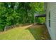 Lush backyard featuring a wooden fence for privacy and mature trees at 5135 Gable Ridge Way, Sugar Hill, GA 30518