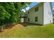 Spacious backyard featuring a deck and lush greenery, perfect for outdoor relaxation at 5135 Gable Ridge Way, Sugar Hill, GA 30518
