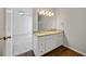 Main bathroom featuring double vanity with granite countertops at 5135 Gable Ridge Way, Sugar Hill, GA 30518