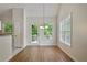 Bright dining area with natural light from windows and access to the patio at 5135 Gable Ridge Way, Sugar Hill, GA 30518