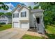 Attractive two-story home featuring a two-car garage and freshly cut lawn at 5135 Gable Ridge Way, Sugar Hill, GA 30518