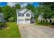 Charming two-story home with a two-car garage and well-maintained front lawn at 5135 Gable Ridge Way, Sugar Hill, GA 30518