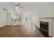 Spacious living room with high ceilings, fireplace, and open to the kitchen at 5135 Gable Ridge Way, Sugar Hill, GA 30518
